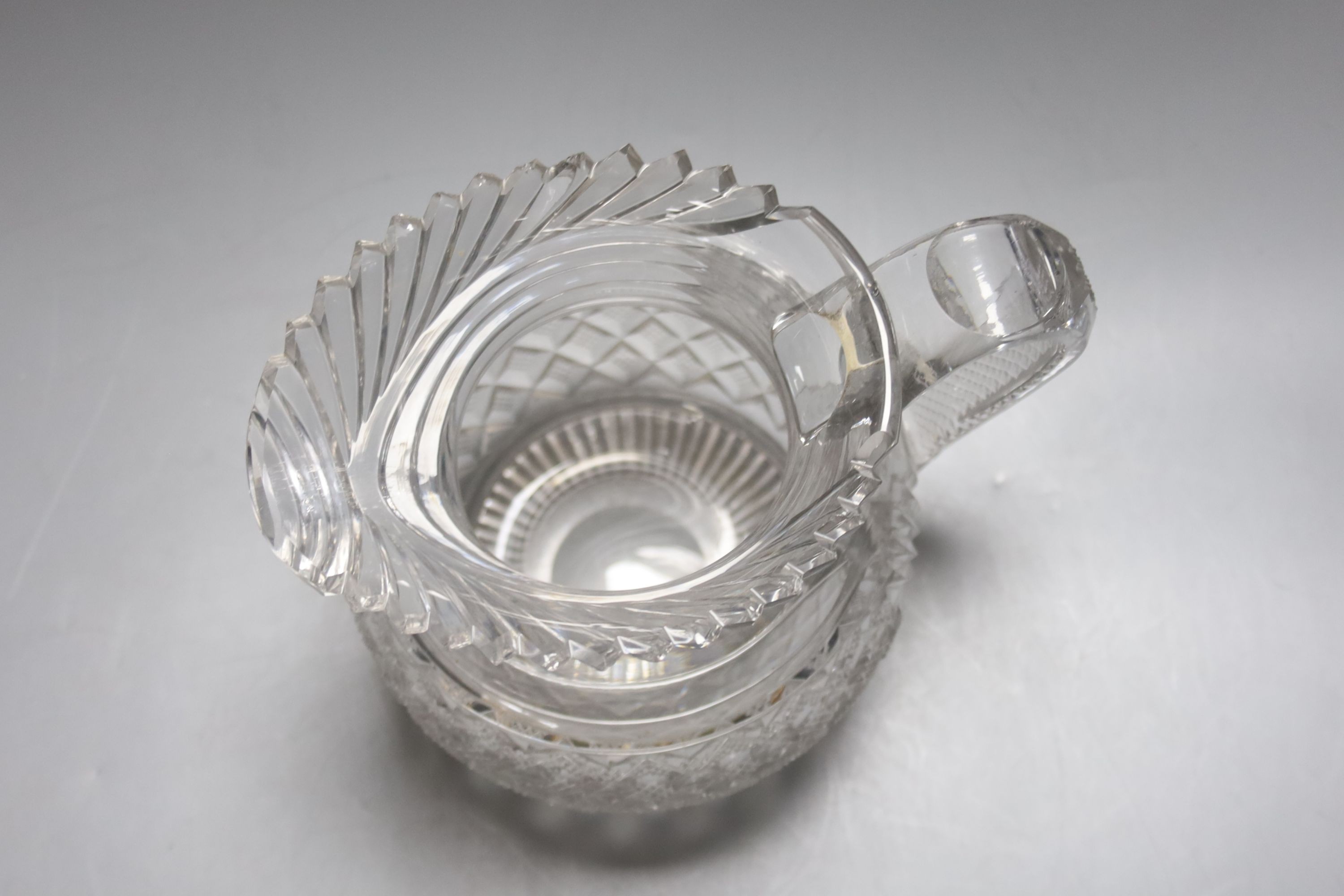 A Regency Irish Waterford crystal jug 16cm, crack to base of handle